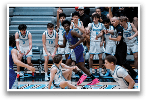 Two basketball players are playing in a game, one is jumping to shoot the ball while the other is trying to block the shot. AI generated content