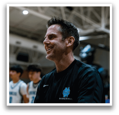 A man wearing a basketball jersey is smiling at the camera. AI generated content