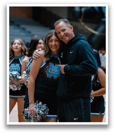 A man and a woman are hugging each other. The woman is wearing a cheerleader outfit. AI generated content