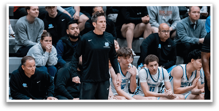 A group of men are sitting on a bench, watching a basketball game. AI generated content