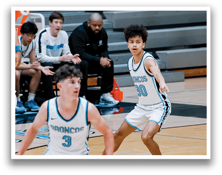 A group of young men playing basketball on a court. AI generated content