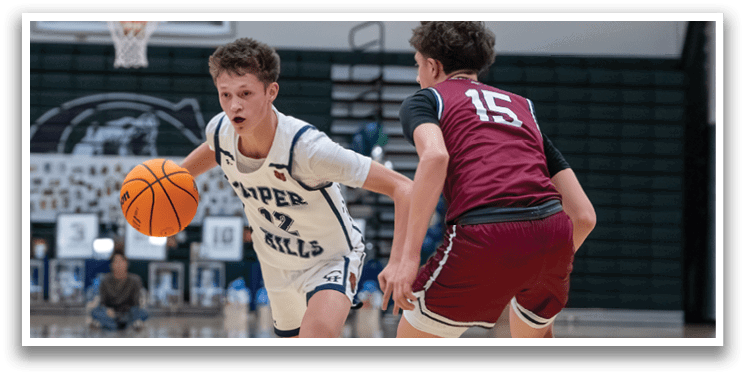 Two boys playing basketball, one wearing a white jersey and the other wearing a red jersey. AI generated content