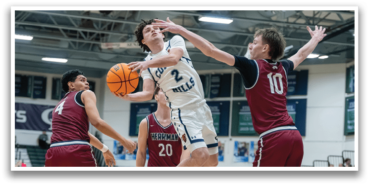 A basketball player is leaping in the air to block a shot, while another player tries to get past him. AI generated content
