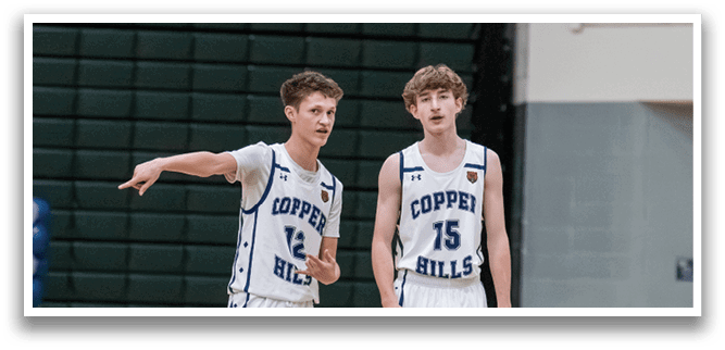 Two boys wearing basketball uniforms are standing on a basketball court. AI generated content
