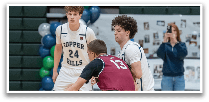 Three boys playing basketball, one of them wearing a maroon jersey. AI generated content