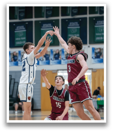 A group of young men playing basketball, with one player jumping to block a shot. AI generated content