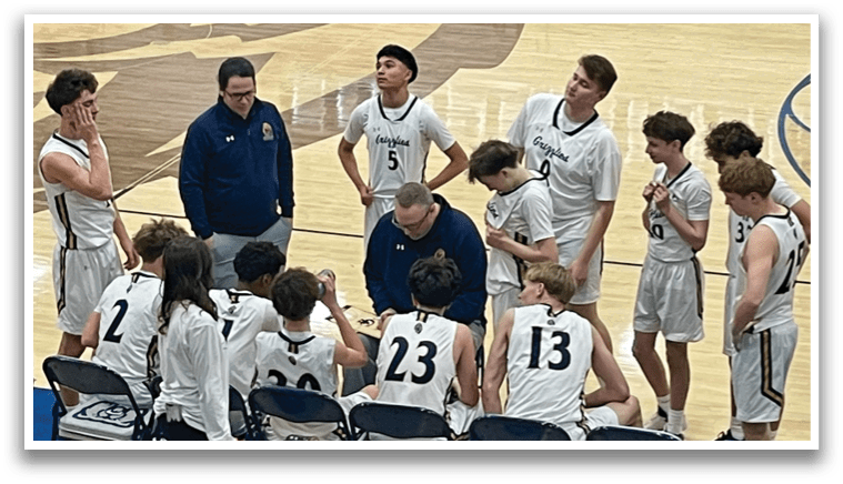 A group of young men playing basketball on a court. AI generated content