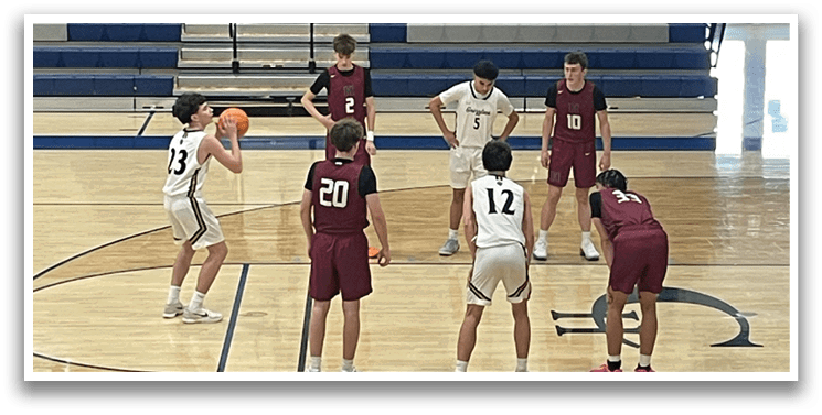 A group of young men playing basketball on a court. AI generated content