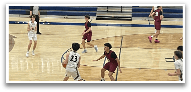 A group of people playing basketball in a gym. AI generated content