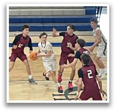 A group of young men playing basketball on a court. AI generated content