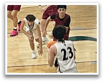 A group of young men playing basketball on a court. AI generated content