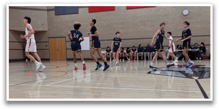 A group of young men playing basketball on a court. AI generated content