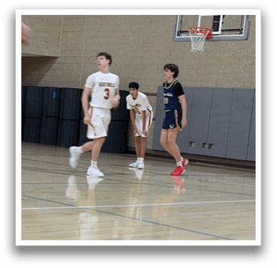 A group of young men playing basketball on a court. AI generated content
