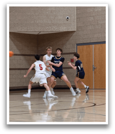 A group of young men playing basketball on a court. AI generated content