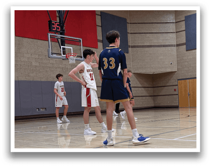 Basketball players on a court, one with the number 33 on his jersey. AI generated content