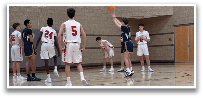 A group of young men playing basketball on a court. AI generated content