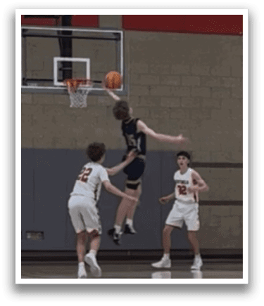 A basketball player leaps in the air to make a shot, while two other players watch from below. AI generated content
