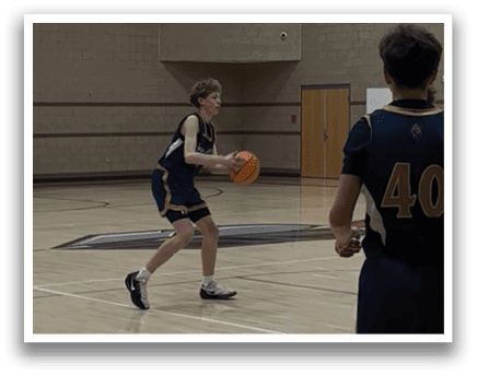 Two young men playing basketball on a court. One of them is holding a basketball. AI generated content