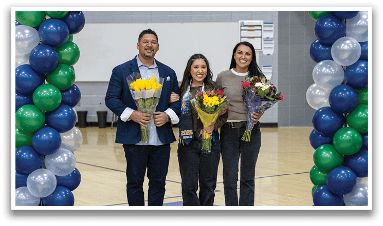 A man and woman stand on a basketball court with a trophy. AI generated content