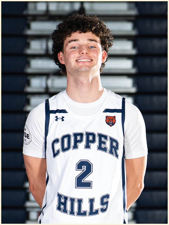 A young man wearing a basketball uniform with the words “Copper Hills" on the front. AI generated content