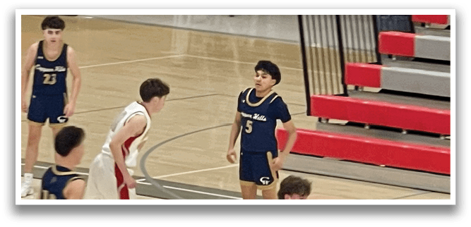 A group of young boys playing basketball on a court. AI generated content