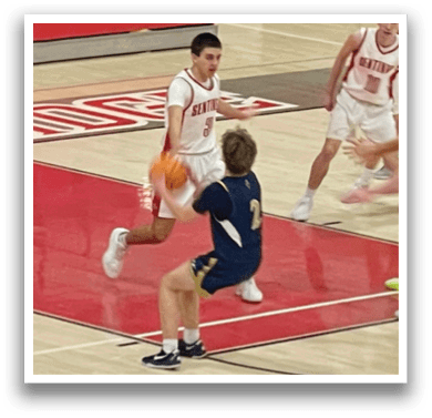 A group of young men playing basketball on a court. AI generated content