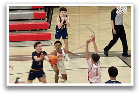 A group of young men playing basketball on a court. AI generated content
