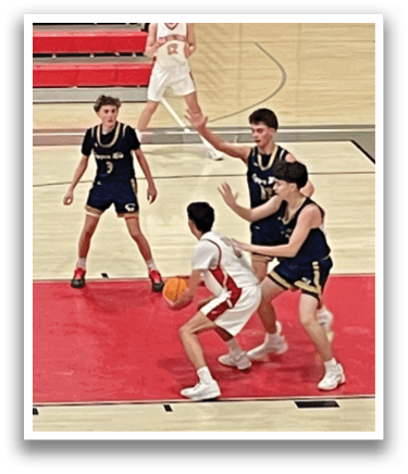 A group of young men playing basketball on a court. AI generated content
