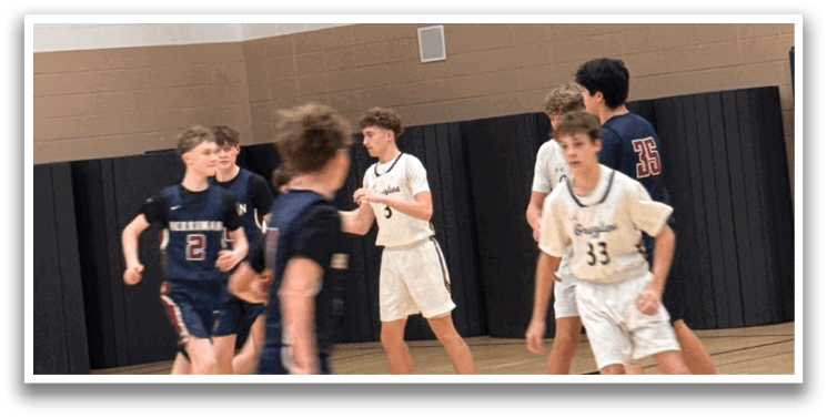 A group of young boys playing basketball in a gym. AI generated content