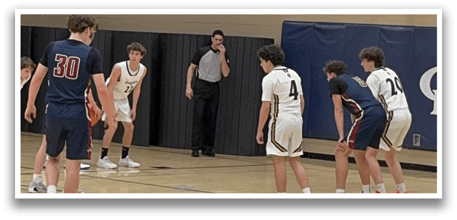 A group of young men playing basketball in a gym. AI generated content