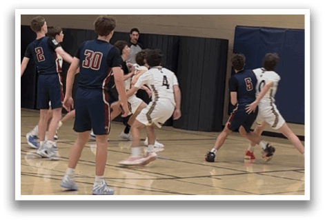 A group of boys playing basketball in a gym. AI generated content