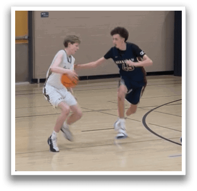 Two boys playing basketball on a court. AI generated content
