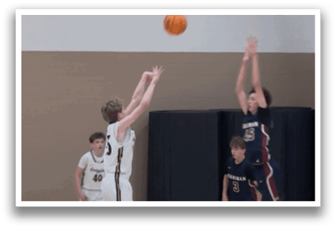 A group of young men playing basketball on a court. AI generated content