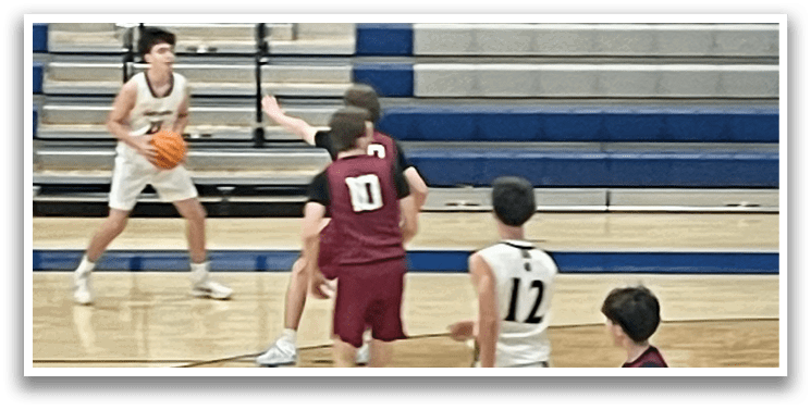 A group of young men playing basketball on a court. AI generated content