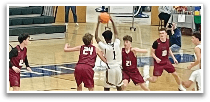 A group of young men playing basketball on a court. AI generated content