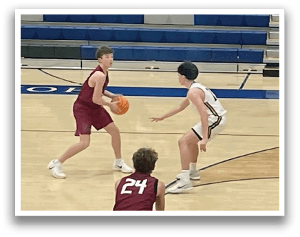 Two basketball players on a court, one with a ball, the other with a basketball. AI generated content