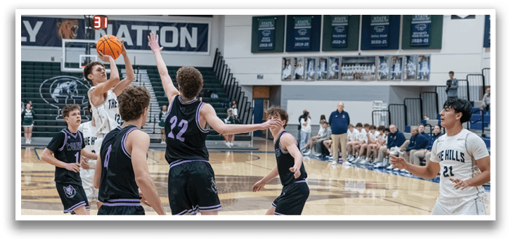 A group of young men playing basketball on a court. AI generated content