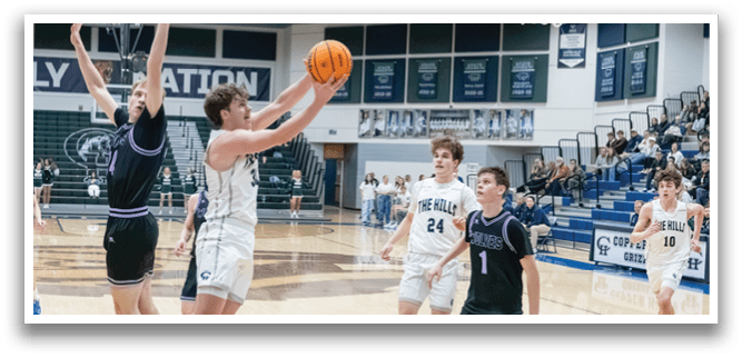 A basketball game is taking place with players on the court. One player is jumping to grab the ball while others watch. The crowd is watching the game from the stands. AI generated content