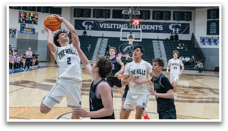 Basketball players on a court, one of them jumping to grab the ball. AI generated content