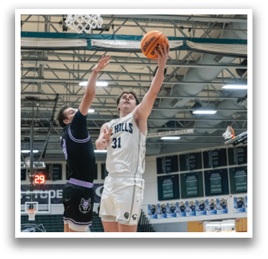 Two basketball players jumping for the ball, one wearing a black shirt and the other wearing a white shirt. AI generated content