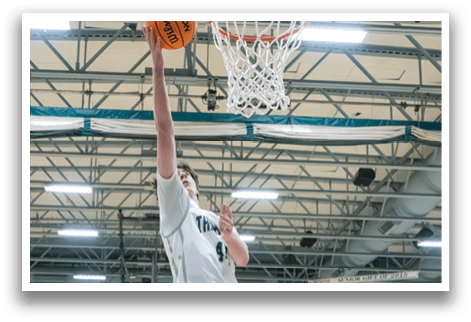 A basketball player leaps in the air to make a shot. AI generated content