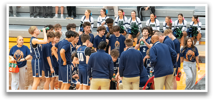 A group of people, including a cheerleader, are standing on a basketball court. AI generated content