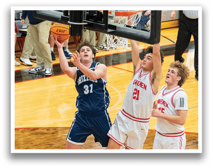 Two basketball players are fighting for a rebound, with one player jumping in the air to gain possession of the ball. AI generated content