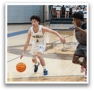 Two basketball players are running for the ball on the court. AI generated content