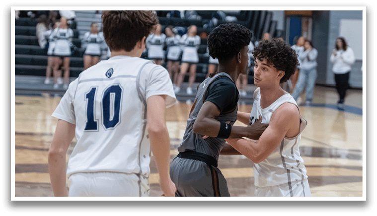 A group of young men playing basketball on a court. AI generated content