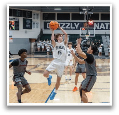 A basketball player in a white uniform jumps to block a shot. AI generated content
