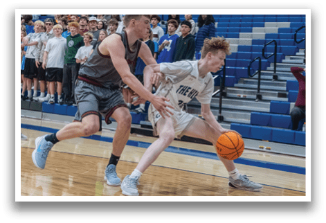 Two men are playing basketball, one is trying to get the ball while the other is trying to stop him. AI generated content