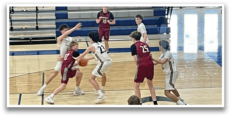 A group of young men playing basketball on a court. AI generated content