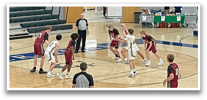 A group of men playing basketball on a court. AI generated content