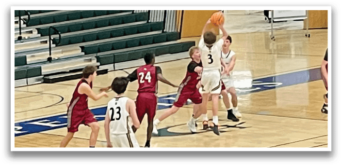 A group of young men playing basketball on a court. AI generated content